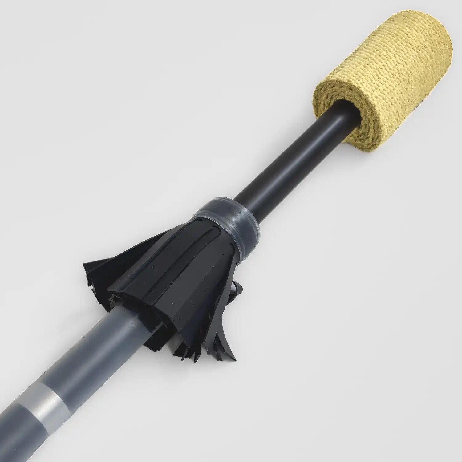 closeup shot of end piece of a fire contact staff highlighting the black flowers