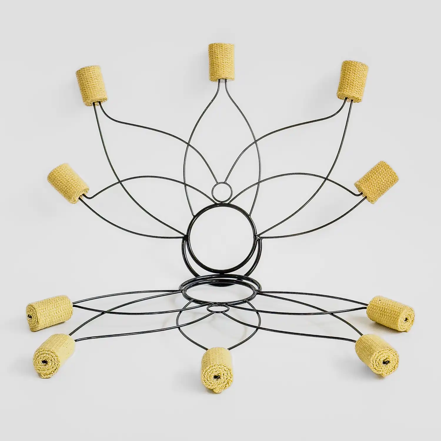 full shot of a pair of flower shaped fire fans that have large russian grip rings