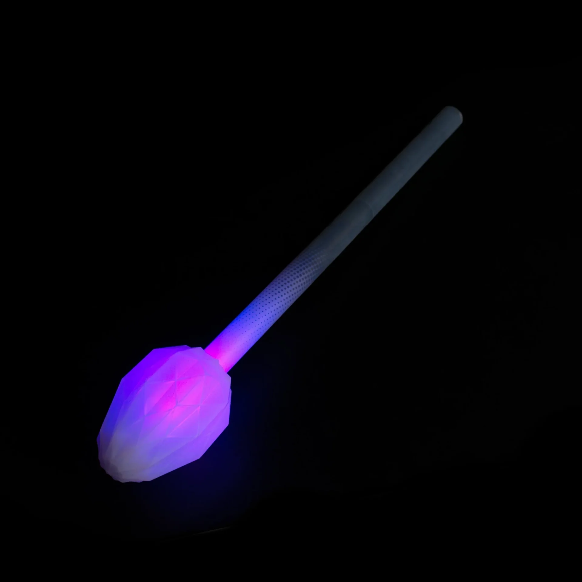 full shot of lit up led fusion prism end in a dark room