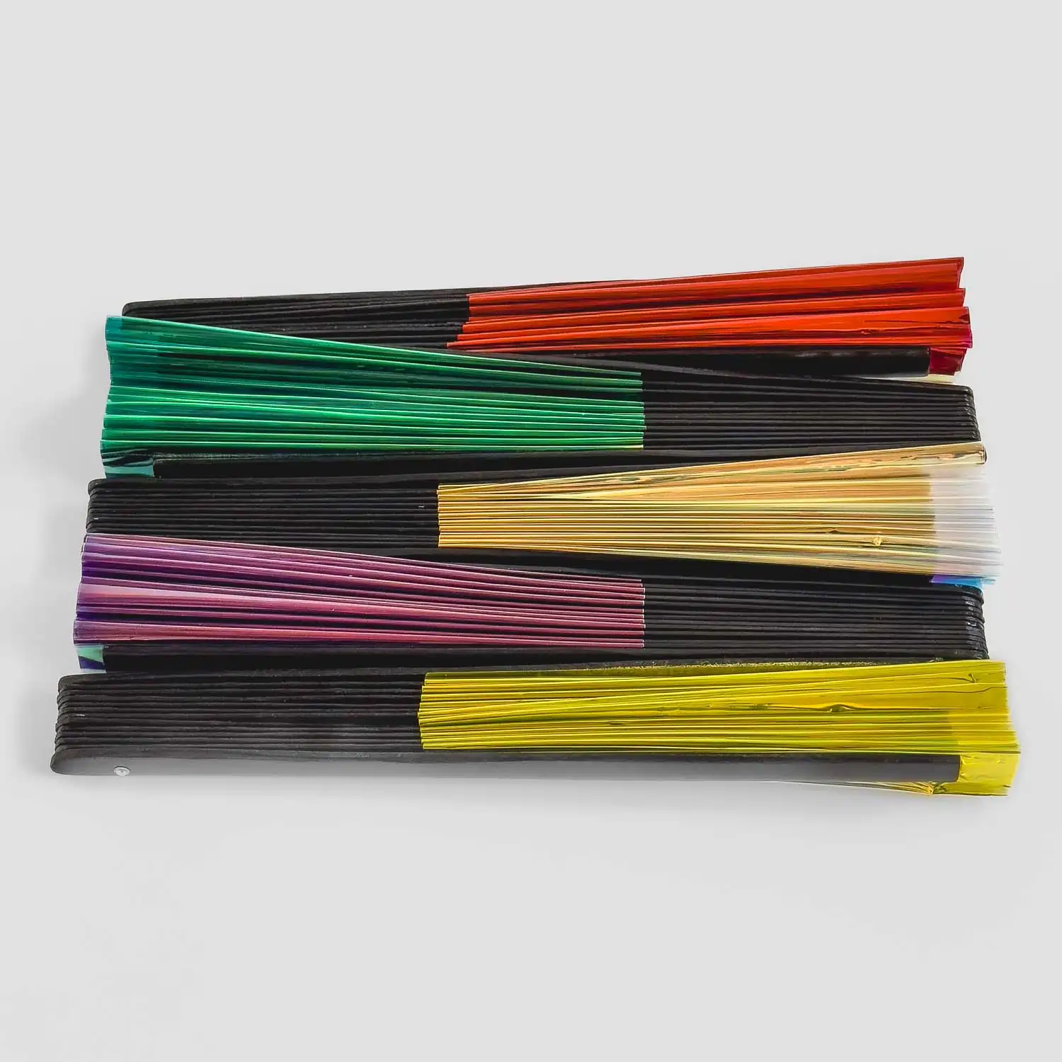full shot of 5 colors of clack fans folded to show color comparison