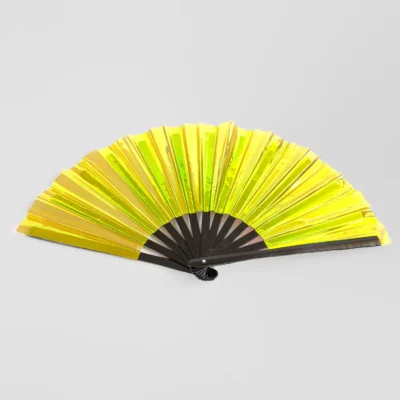 full shot of a laid out clack fan with black ribs and yellow coloring