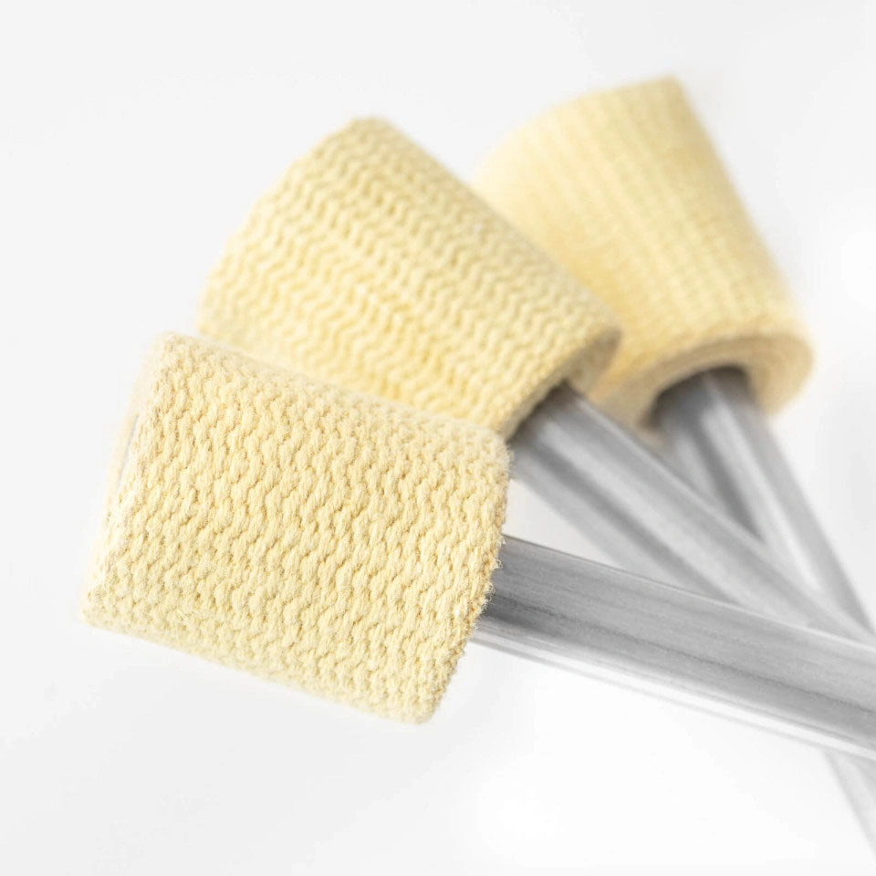 closeup shot of the kevlar wick on a set of 3 fire juggling clubs