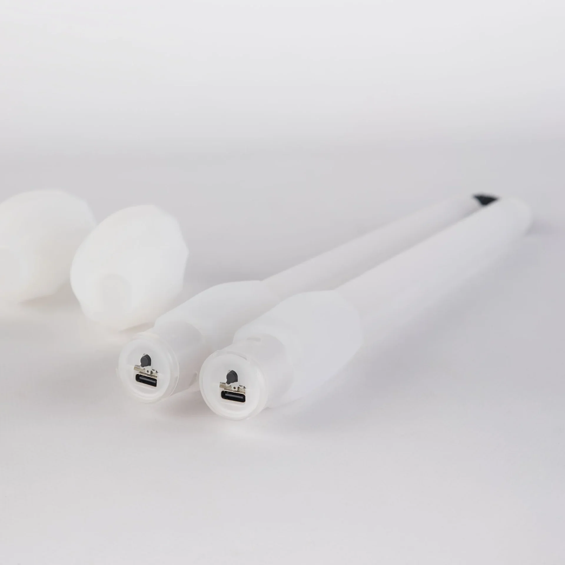 closeup photo showing where the charging ports for the led nunchucks are located