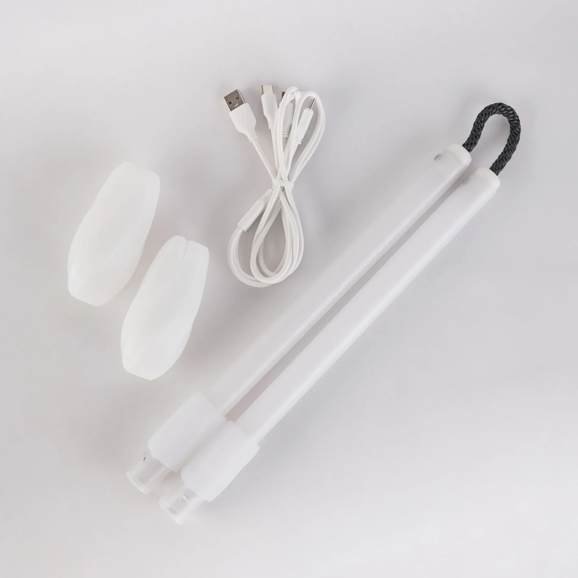 full shot of unassembled led nunchucks and their components