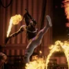 Action shot of performing using fire sword with lycopodium powder