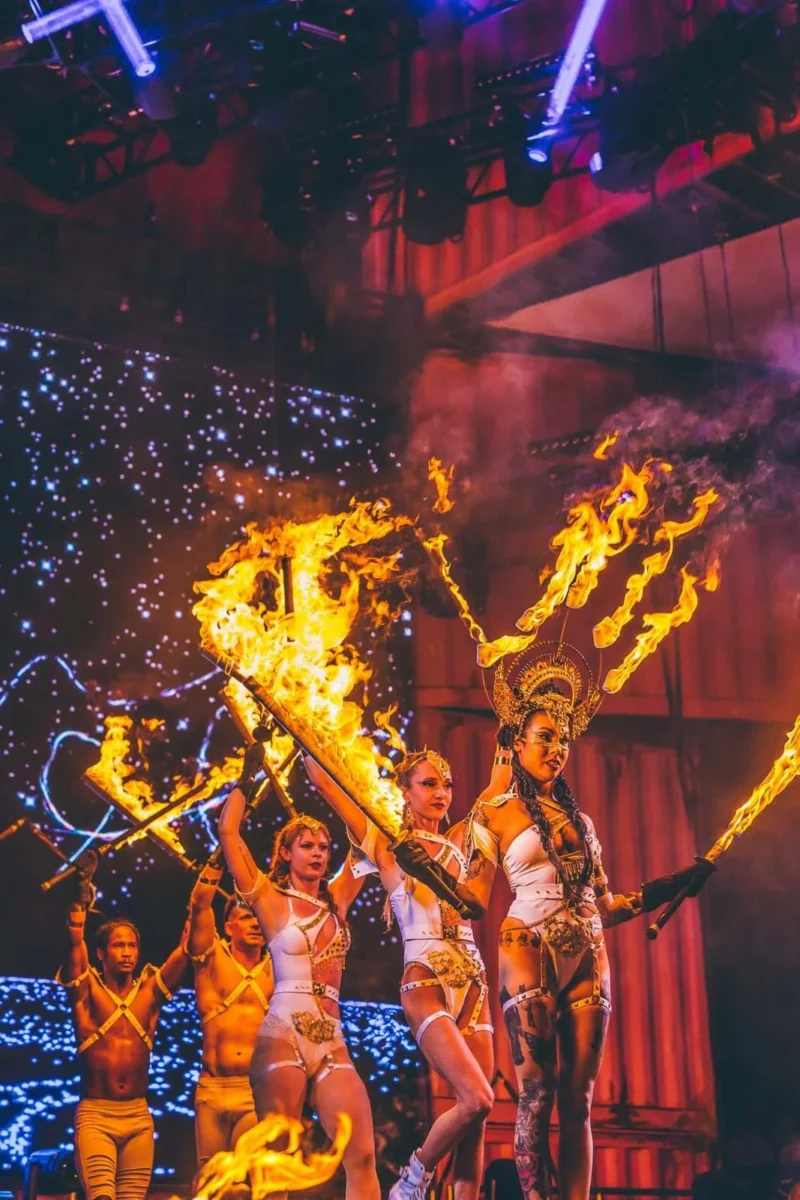 Action shot of performing using fire sword with lycopodium powder