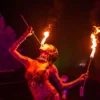 Action shot of a fire performer eating fire