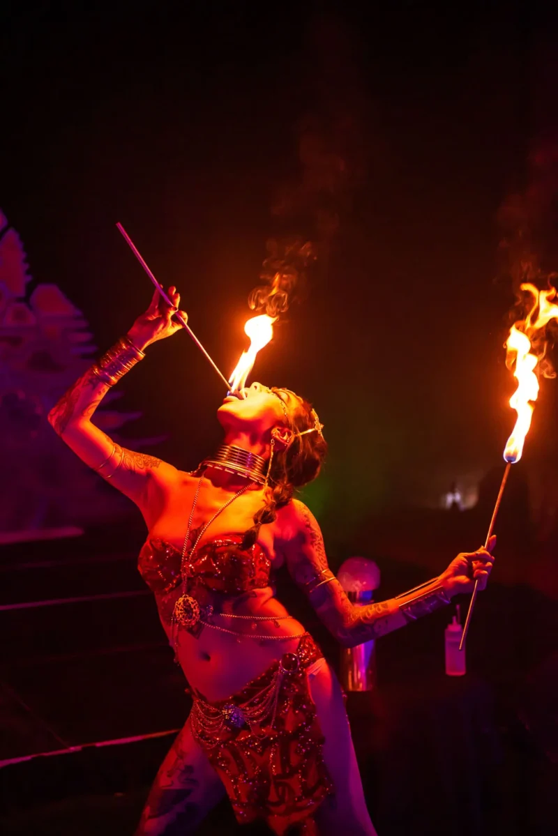 Action shot of a fire performer eating fire