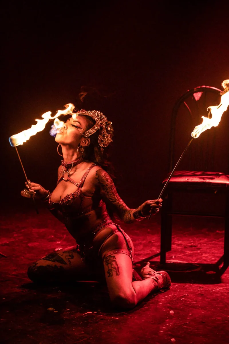 Action shot of a fire performer eating fire