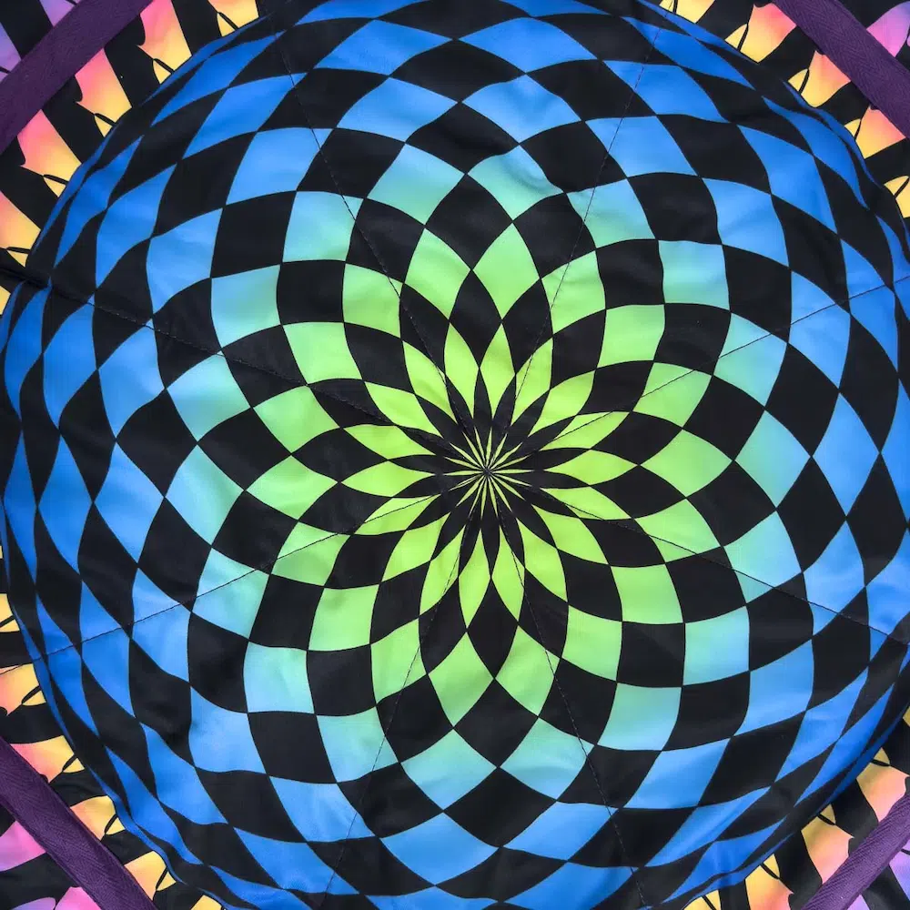 closeup shot of flow star with checkerboard mandala design