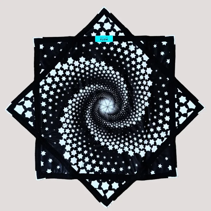 full shot of flow star with black background and white spiral star design