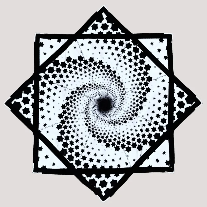 full shot of flow star with white background and black spiral star design