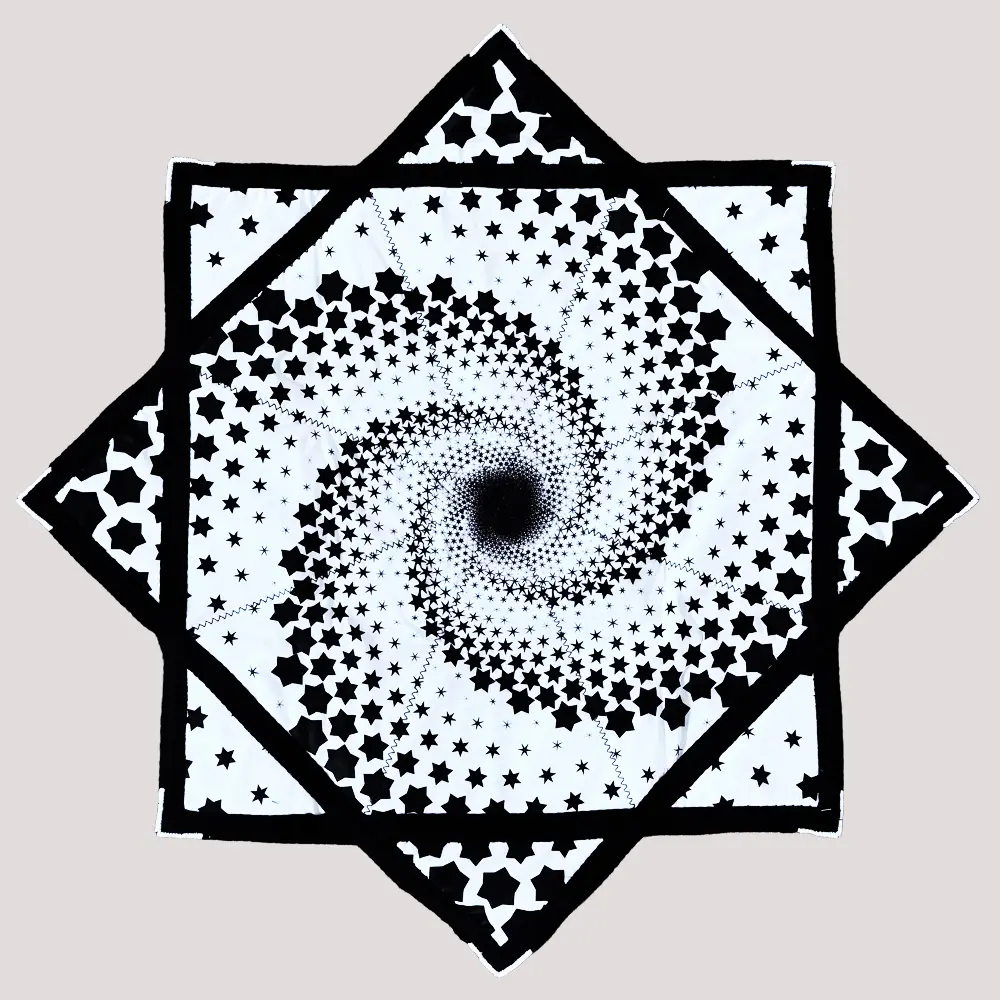 full shot of flow star with white background and black spiral star design