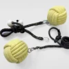 monkey fist fire rope dart and poi laying side by side