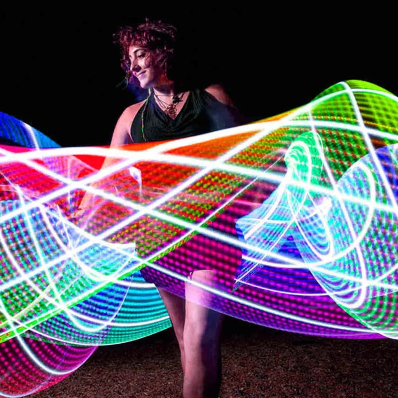flow artist using a hula hoop and showing light trails