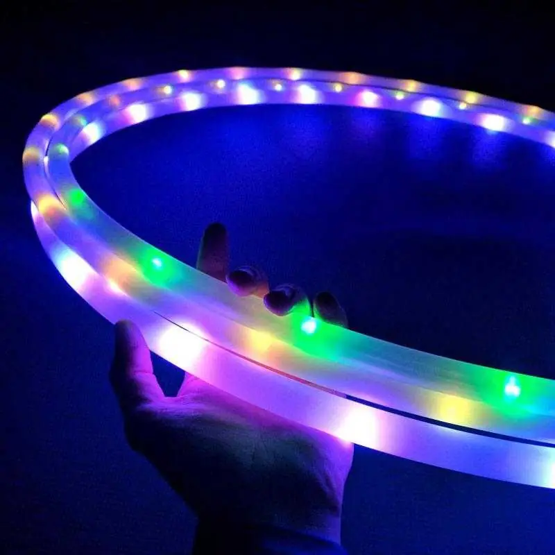 3 ultrahoops being held in a dark room while they're turned on