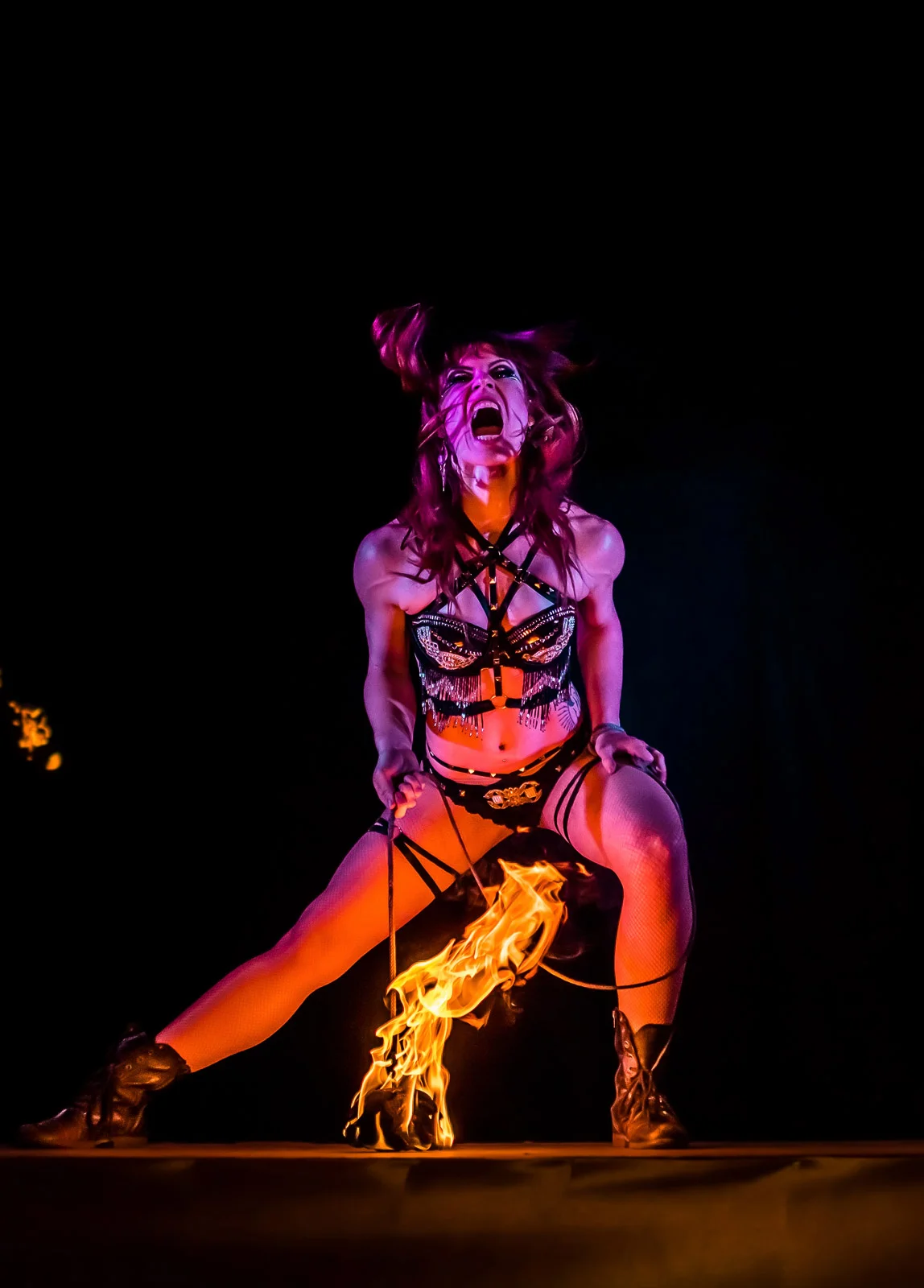 action shot of flow mayhem posing with shuriken fire rope dart