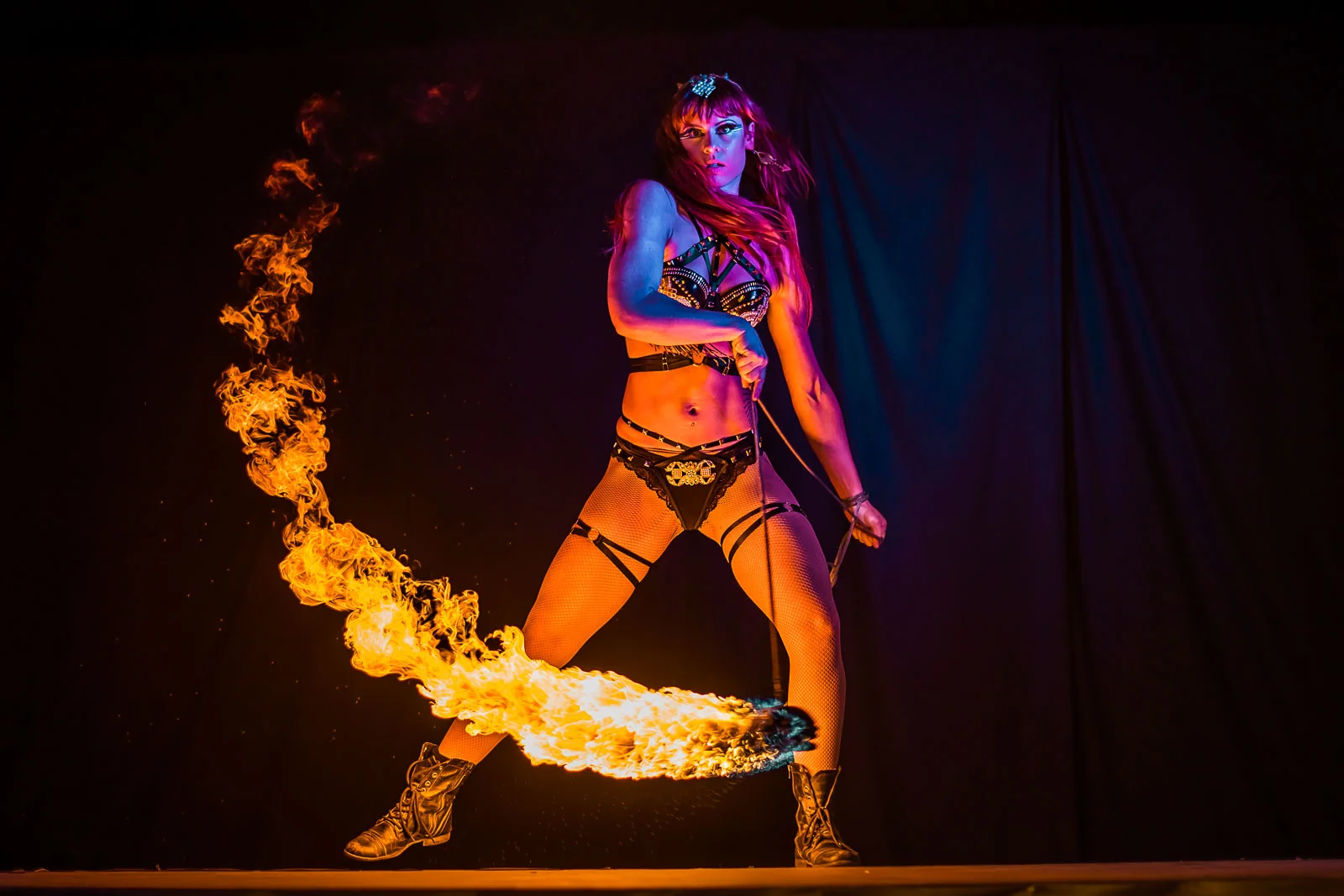 action shot of flow mayhem posing with shuriken fire rope dart