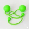 Full shot of a pair of green contact poi with large silicone knobs