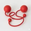 Full shot of a pair of red contact poi with large silicone knobs