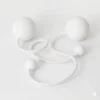 Full shot of a pair of white contact poi with large silicone knobs